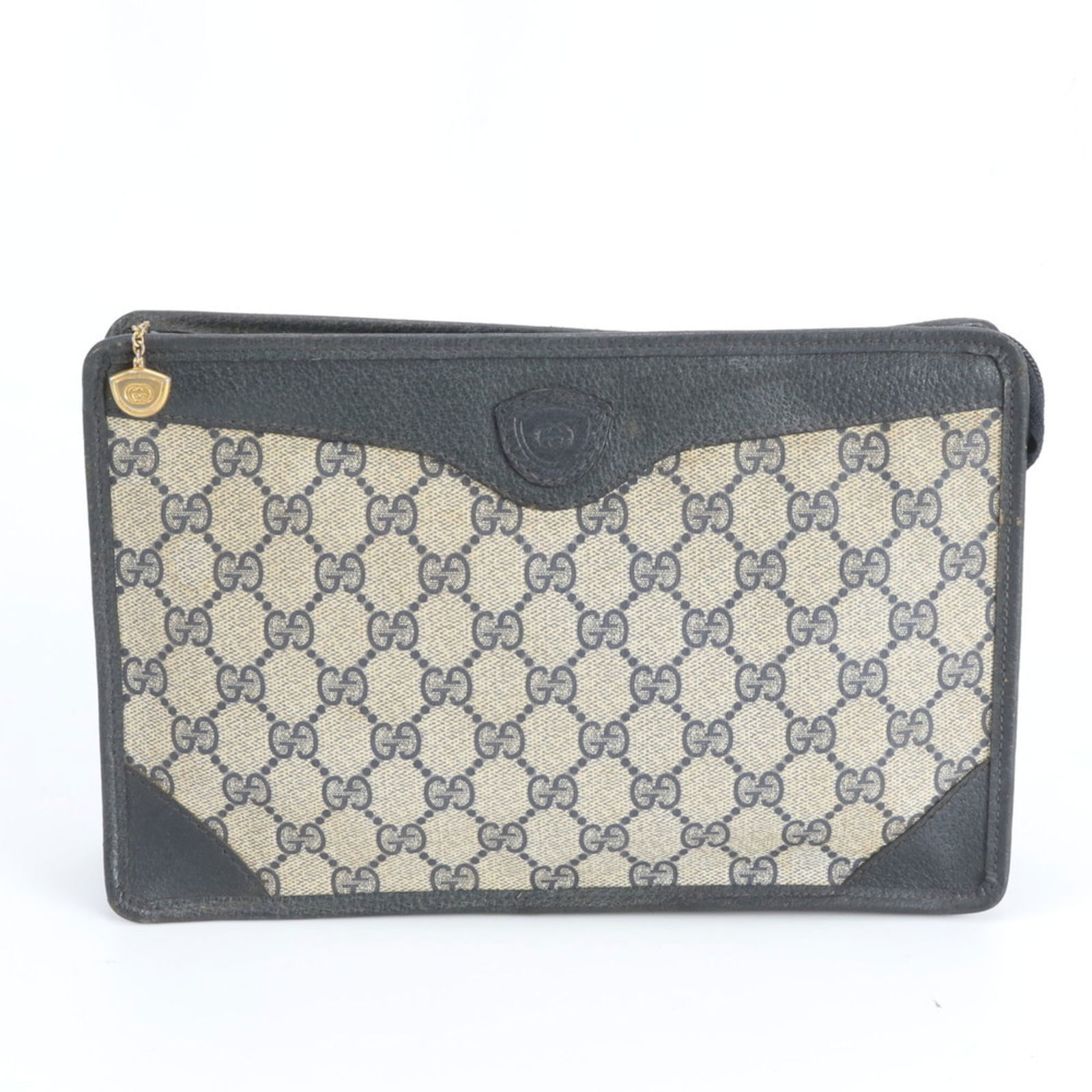 Gucci Clutch Bag in Leather and Coated Canvas: Gucci Clutch Bag in Leather and Coated Canvas A sleek and sophisticated Gucci clutch bag, crafted from luxurious leather and coated canvas, adds a touch of high-end glamour to any evening outfit.