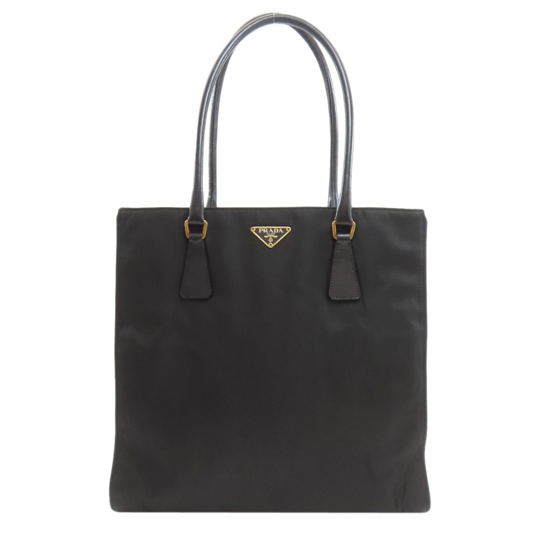Prada Logo Hardware Tote Bag in Nylon: Prada Logo Hardware Tote Bag in Nylon Elevate your everyday style with the iconic Prada Logo Hardware Tote Bag, crafted from high-quality nylon in sleek black. The timeless design boasts classic