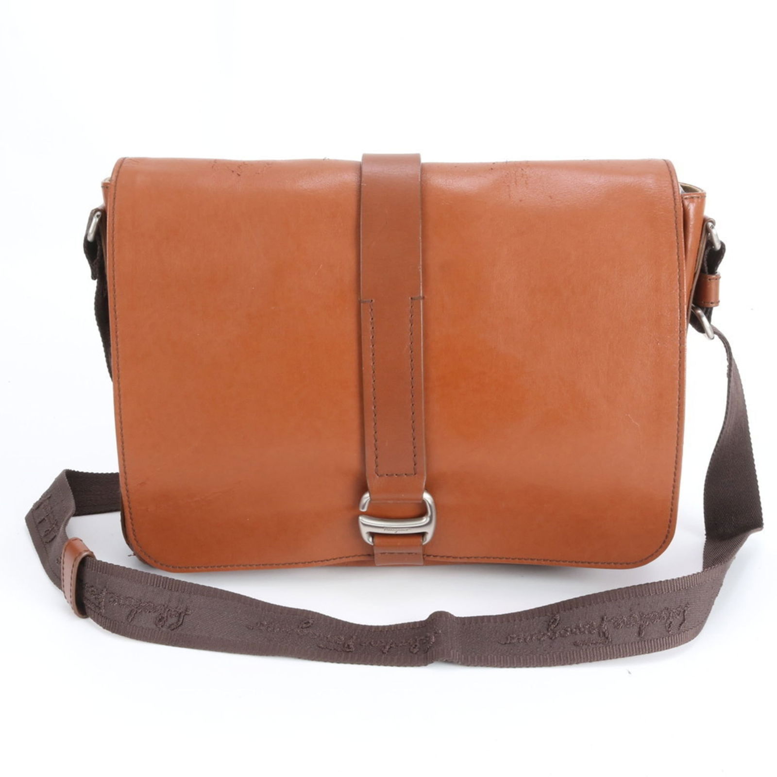 Salvatore Ferragamo Leather Messenger Bag: Salvatore Ferragamo Leather Messenger Bag A timeless piece for the modern man, this Salvatore Ferragamo leather messenger bag boasts rich brown leather and a sleek design that exudes sophistication. W
