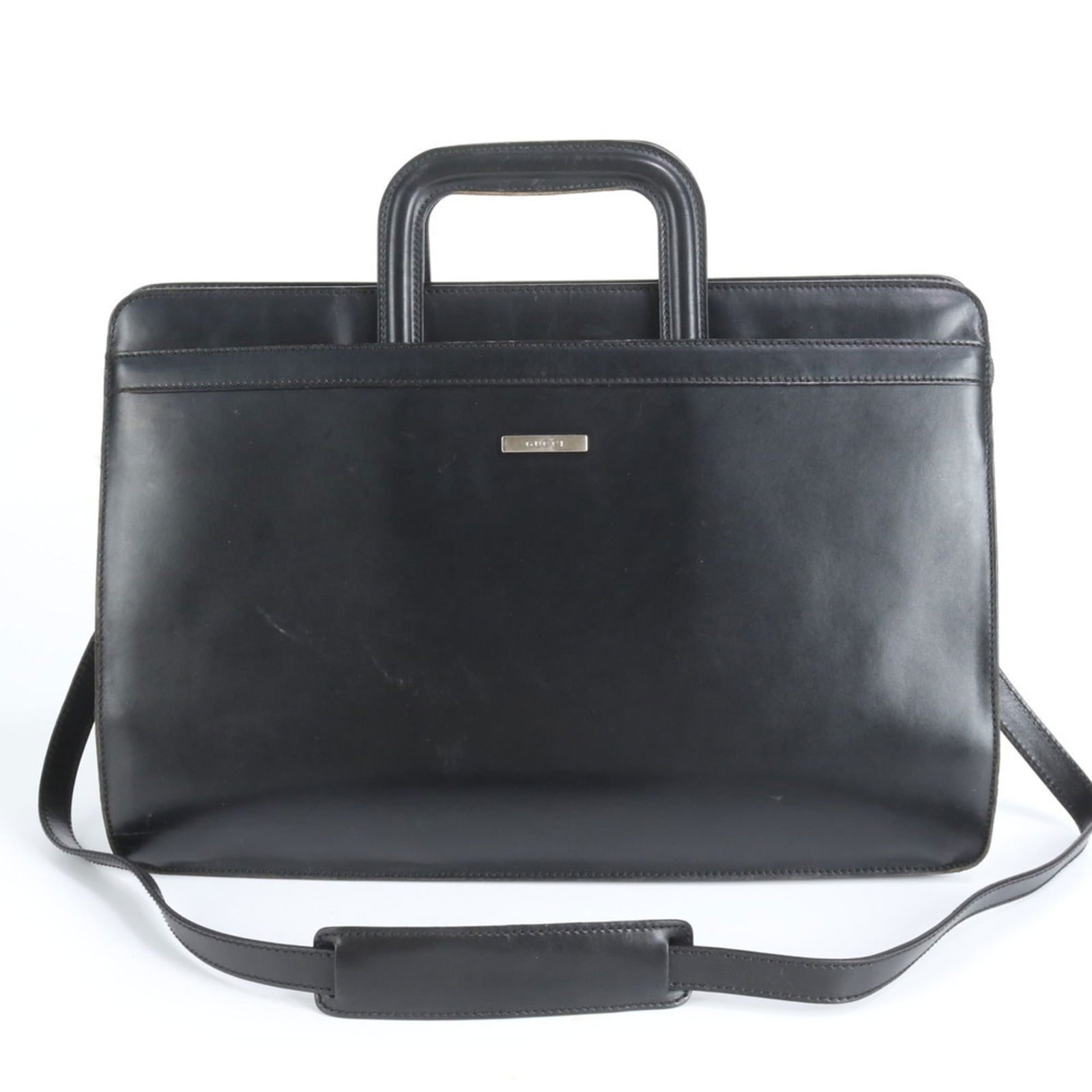 Gucci Briefcase in Leather: Gucci Briefcase in Leather A sleek and sophisticated Gucci briefcase in black leather, perfect for the modern professional on-the-go. With its classic design, spacious interior, and durable