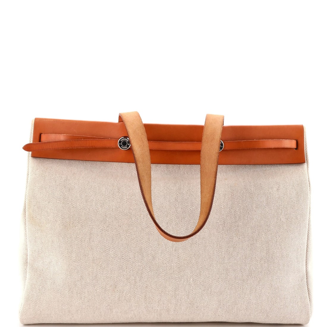 MM Hermes Herbag Cabas Toile and Leather: MM Hermes Herbag Cabas Toile and Leather The iconic MM Hermes Herbag Cabas Toile and Leather is a timeless tote that exudes understated elegance. With its neutral canvas exterior, rich leather