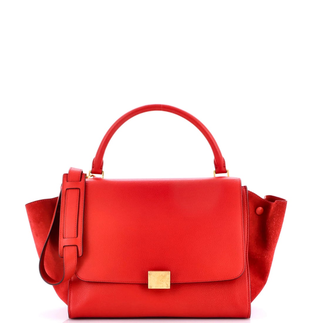 Celine Trapeze Bag in Medium Leather: Celine Trapeze Bag in Medium Leather The Celine Trapeze Bag in Medium Leather is a timeless piece with its sleek, red suede exterior and classic top handle design. With its spacious interior and adjus