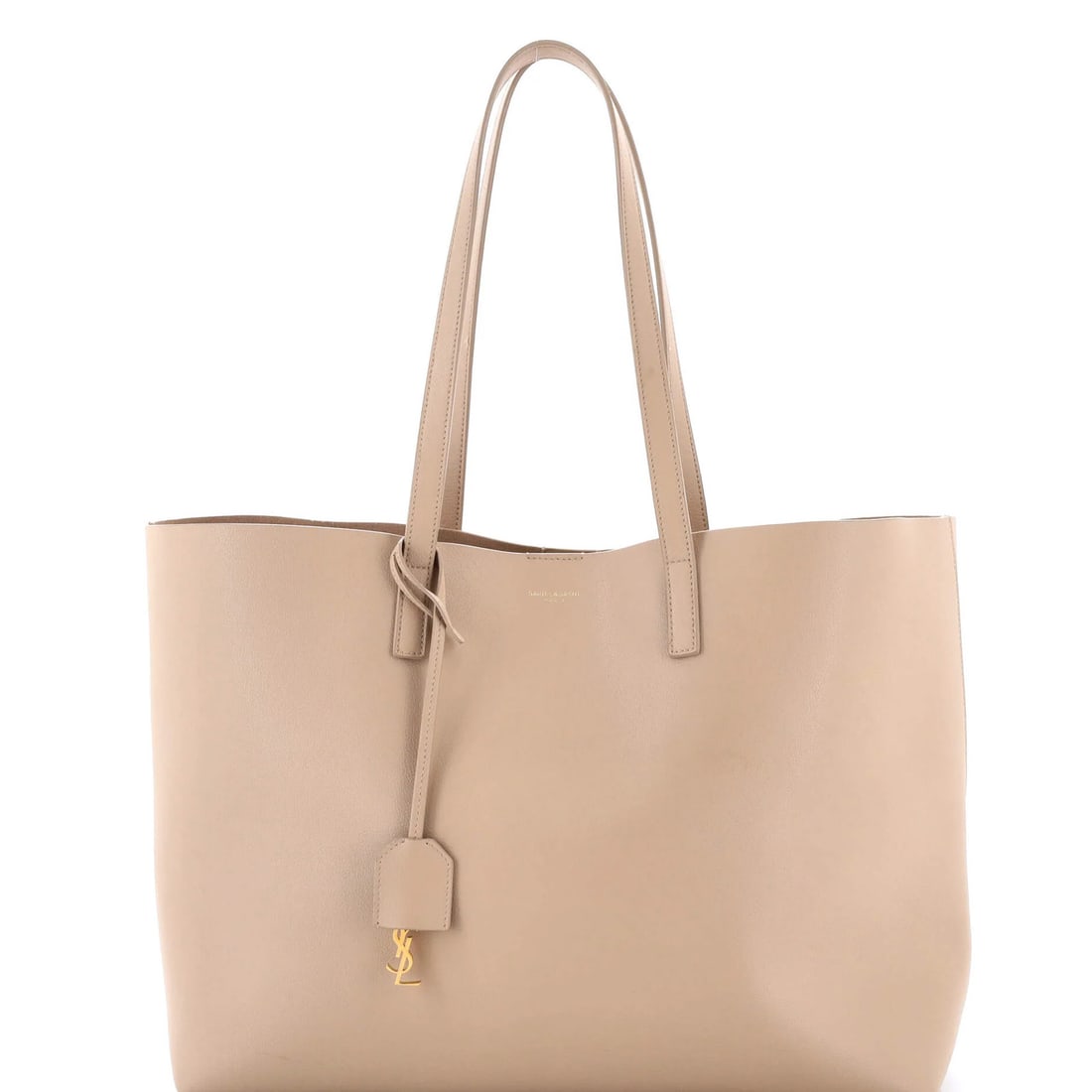 Saint Laurent Large Leather Shopper Tote: Saint Laurent Large Leather Shopper Tote Experience the timeless elegance of Saint Laurent's Large Leather Shopper Tote, boasting neutral tones and premium raw leather construction that exudes