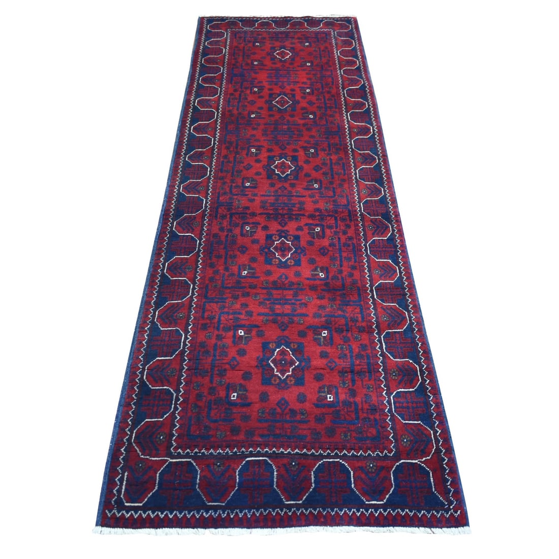 Rug 2'8"x9' Red Afghan Khamyab Wool Geometric Design Hand Knotted Runner: Rug 2'8"x9' Red Afghan Khamyab Wool Geometric Design Hand Knotted Runner Experience the rich cultural heritage of Afghanistan with this stunning, hand-knotted wool runner from AFGHANISTAN. Featuring a