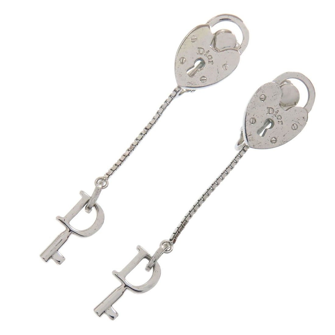 Metal CHRISTIAN DIOR Heart Cadena Key Chain Earring: Metal CHRISTIAN DIOR Heart Cadena Key Chain Earring Elevate your everyday style with the iconic Christian Dior Heart Cadena key chain earring, a sleek and sophisticated accessory that adds a touch of
