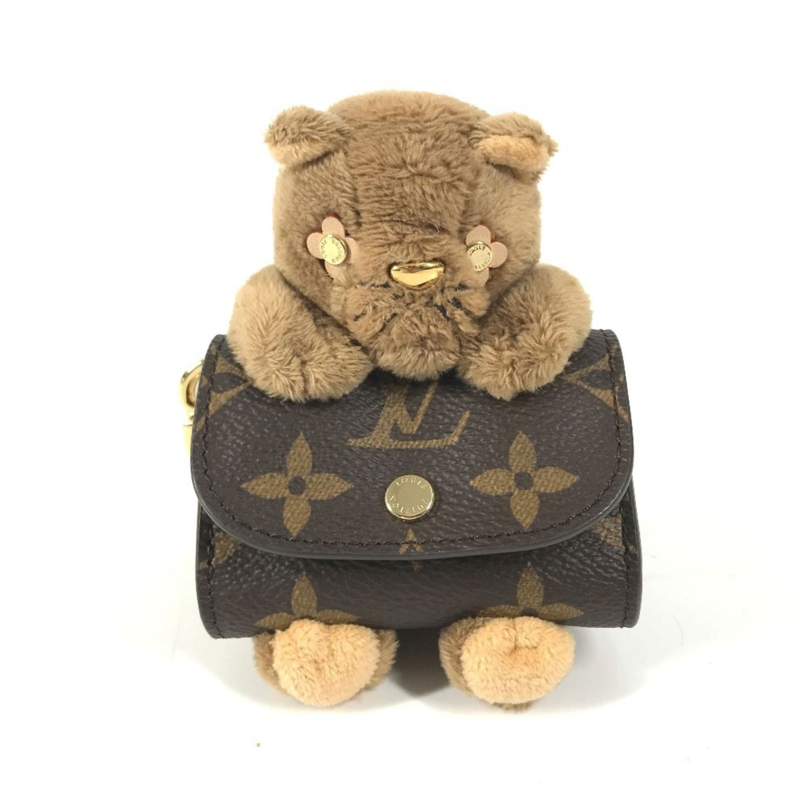 Louis Vuitton Monogram Fur Keyring: Louis Vuitton Monogram Fur Keyring Add a touch of luxury to your everyday essentials with this exquisite Louis Vuitton Monogram Fur Keyring, boasting the iconic brand's signature brown monogram
