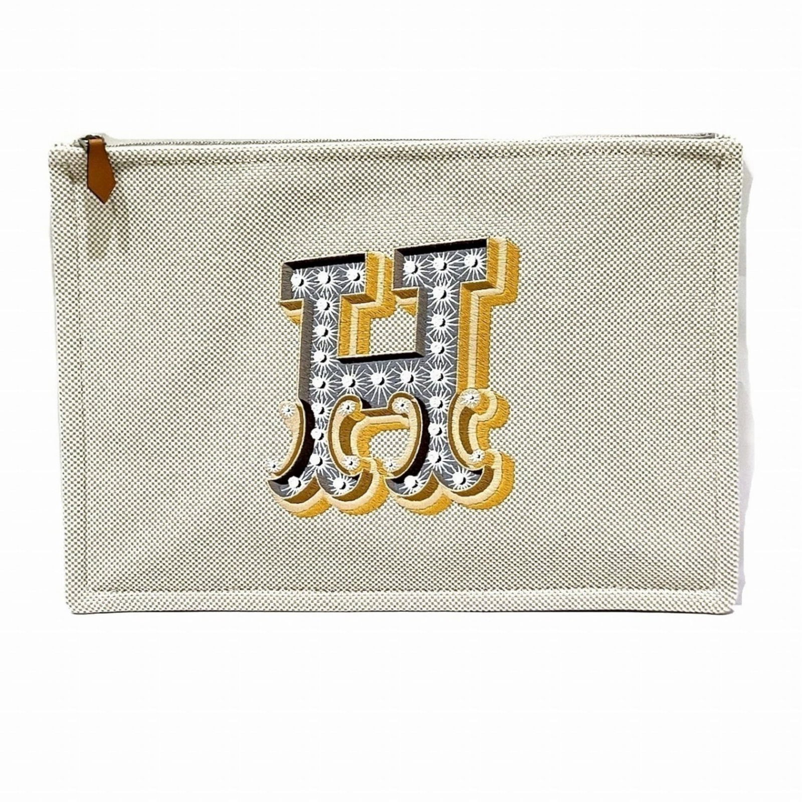 Hermes Canvas Clutch Bag: Hermes Canvas Clutch Bag A pristine white canvas clutch from the iconic French fashion house Hermes, boasting a timeless design with clean lines and elegant simplicity. With its compact size and