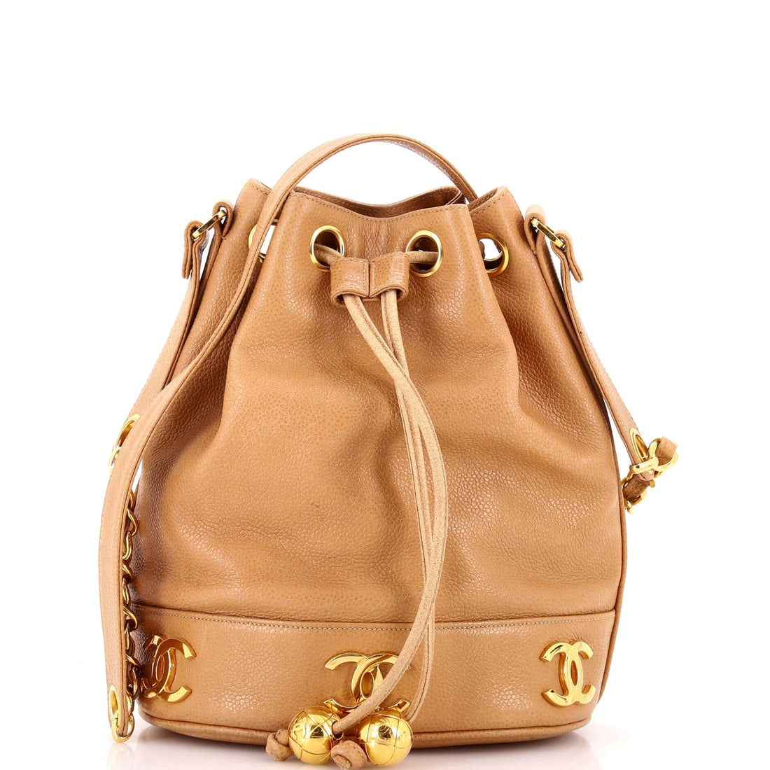 Chanel Vintage Caviar Mini Drawstring Bucket Bag: Chanel Vintage Caviar Mini Drawstring Bucket Bag A rare and coveted Chanel Caviar Mini Drawstring Bucket Bag, this vintage piece boasts the iconic interlocking CC logo and sleek, neutral exterior