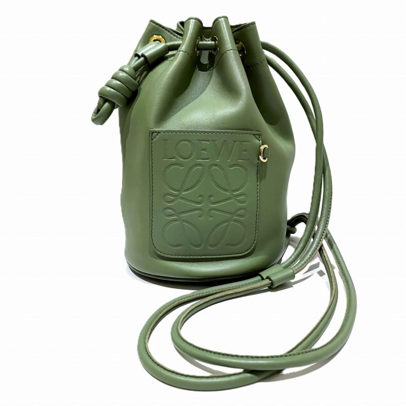 Loewe Leather Shoulder Bag: Loewe Leather Shoulder Bag Elevate your style with the timeless Loewe Leather Shoulder Bag, boasting rich dark green leather and sleek lines that exude sophistication. With its classic design and