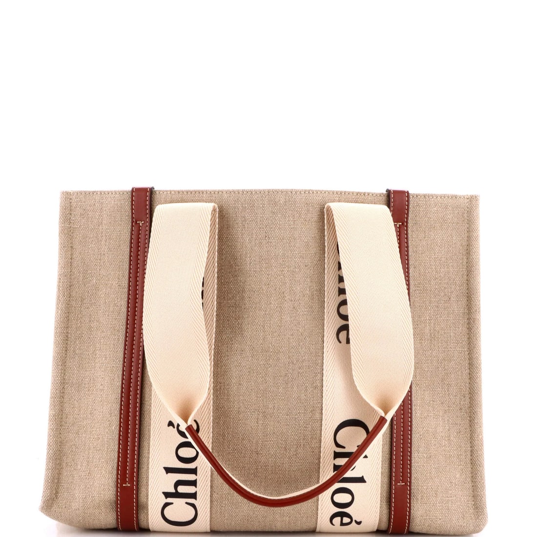 Chloe Woody Medium Canvas Tote with Leather: Chloe Woody Medium Canvas Tote with Leather Elevate your everyday with the timeless Chloe Woody Medium Canvas Tote, boasting a chic combination of canvas and rich leather in a versatile brown hue. Its