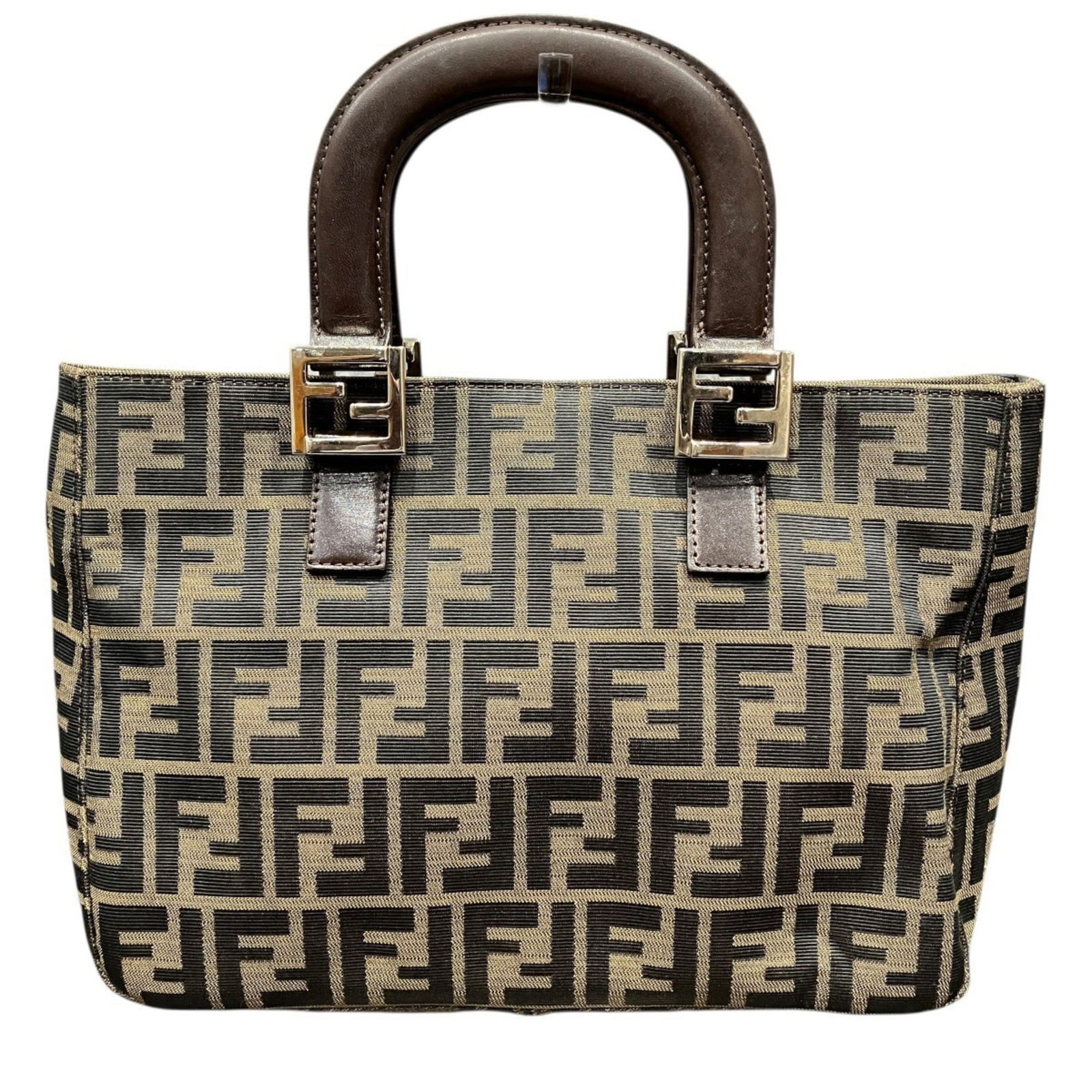 Fendi Handbag in Nylon and Leather: Fendi Handbag in Nylon and Leather A luxurious Fendi handbag in rich brown hues, crafted from high-quality nylon and supple leather, boasts a timeless design that exudes sophistication and elegance.