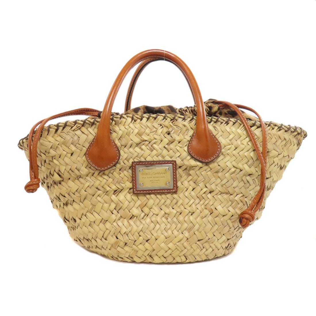 Dolce & Gabbana Leopard Print Raffia Tote Bag: Dolce & Gabbana Leopard Print Raffia Tote Bag Elevate your style with the iconic Dolce & Gabbana leopard print raffia tote bag, crafted from high-quality beige raffia that exudes effortless chic.