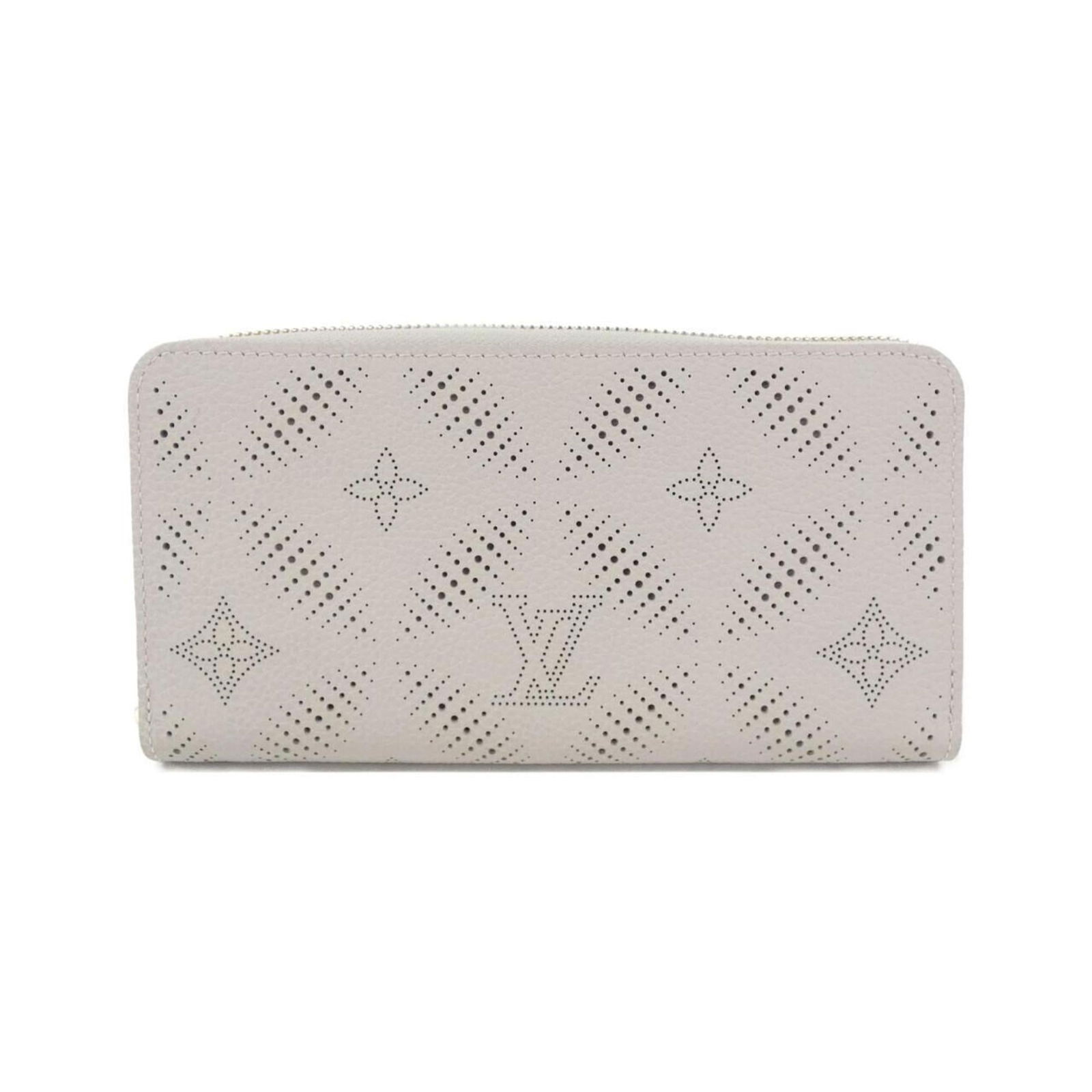 Louis Vuitton Bi-Fold Leather Wallet: Louis Vuitton Bi-Fold Leather Wallet A timeless piece from the iconic Louis Vuitton brand, this bi-fold leather wallet boasts classic design and premium quality. Made from rich calf leather in a