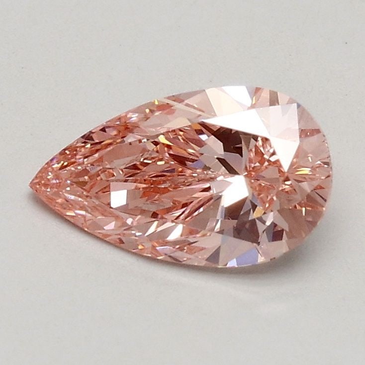 Loose Lab Diamond - IGI Pear 0.55ct Fancy Vivid Pink VVS2: Loose Lab Diamond - IGI Pear 0.55ct Fancy Vivid Pink VVS2 Experience the unparalleled beauty of a lab-grown diamond, certified by the International Gemological Institute (IGI) as Fancy Vivid Pink, wit