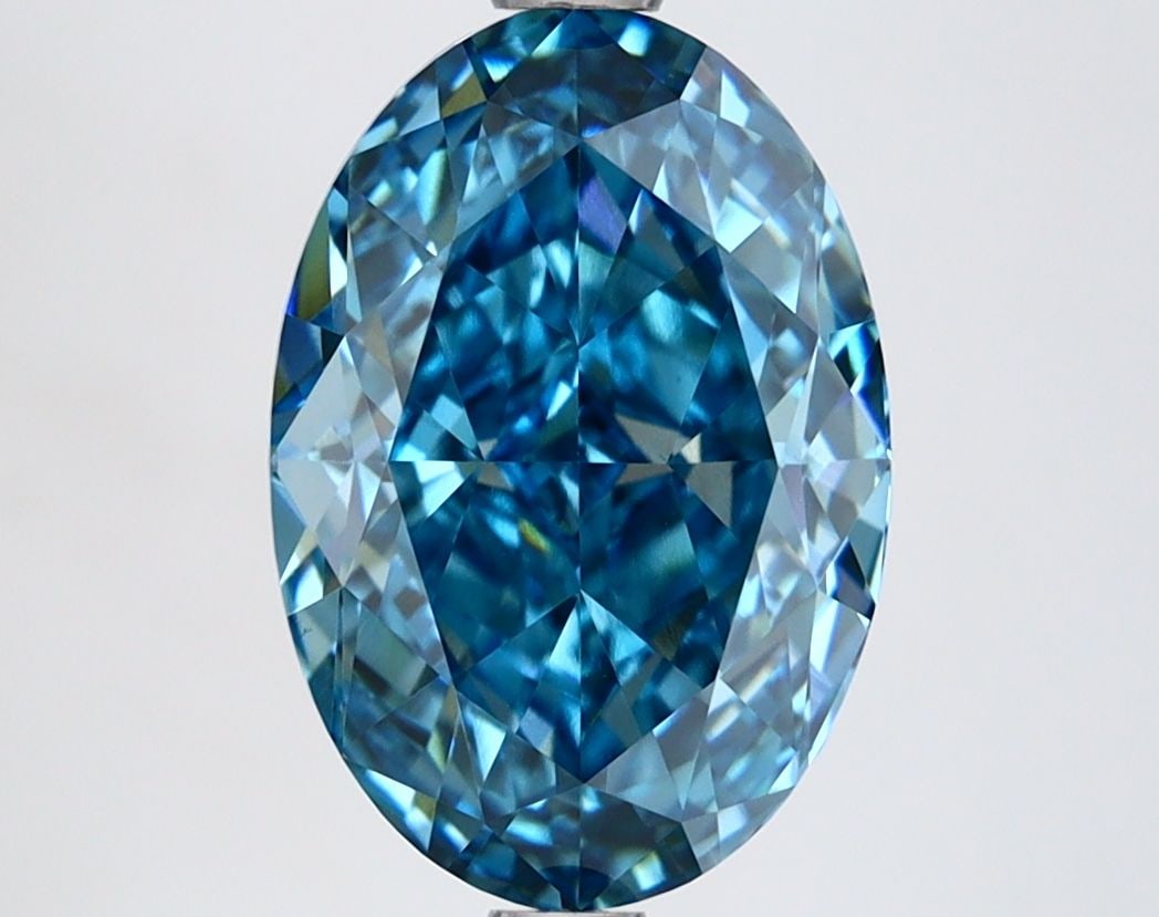 IGI Oval 3.51ct Fancy Vivid Blue VVS2 Loose Lab Diamond: IGI Oval 3.51ct Fancy Vivid Blue VVS2 Loose Lab Diamond Experience the breathtaking beauty of a Fancy Vivid Blue diamond, one of the rarest and most coveted colors in nature. This stunning 3.51ct lab-