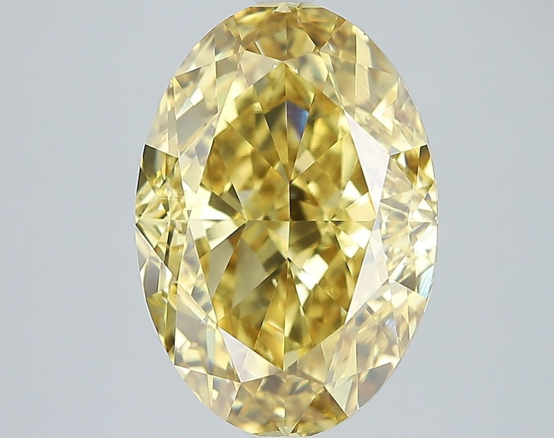 IGI Oval 7.22ct Fancy Vivid Yellow VVS2 Loose Lab Diamond: IGI Oval 7.22ct Fancy Vivid Yellow VVS2 Loose Lab Diamond Experience the brilliance of nature in a lab-grown diamond, boasting an impressive 7.22 carats of Fancy Vivid Yellow color and exceptional cla