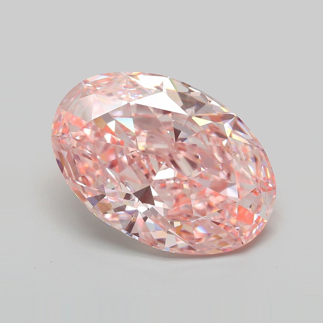 IGI Oval 14.25ct Fancy Vivid Pink VVS2 Loose Lab Diamond: IGI Oval 14.25ct Fancy Vivid Pink VVS2 Loose Lab Diamond Experience the unparalleled beauty of a lab-grown Fancy Vivid Pink diamond, boasting an impressive 14.25 carats and exceptional clarity with a