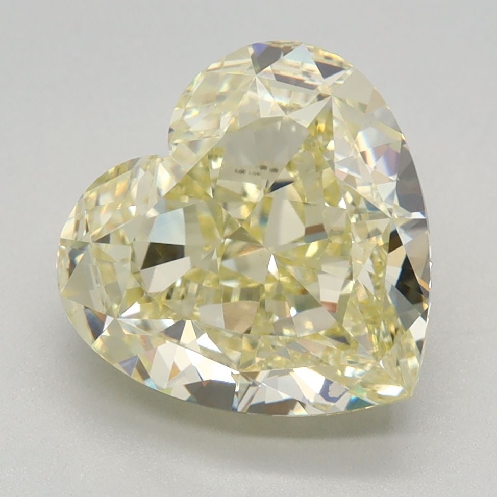 Loose Lab Diamond - IGI Heart 3.24ct Fancy Yellow VVS2: Loose Lab Diamond - IGI Heart 3.24ct Fancy Yellow VVS2 This exquisite loose lab diamond boasts an impressive 3.24 carats of vibrant Fancy Yellow color, rivaling the warmth and lightness of a sunny day