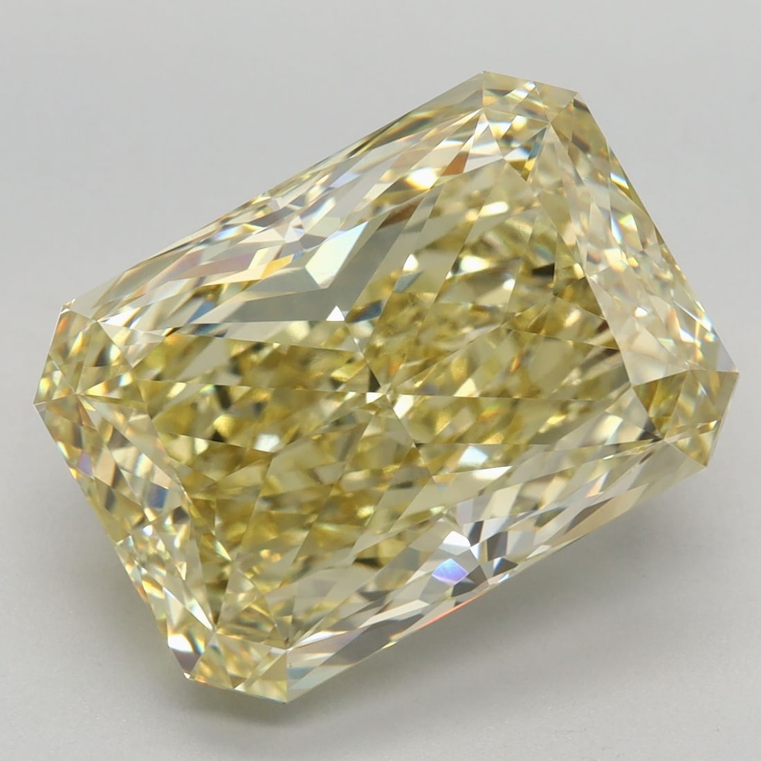 IGI Radiant 9.03ct Fancy Vivid Yellow VVS2 Loose Lab Diamond: IGI Radiant 9.03ct Fancy Vivid Yellow VVS2 Loose Lab Diamond Experience the unparalleled brilliance of a lab-grown diamond, certified by IGI as a Fancy Vivid Yellow VVS2 Loose 9.03ct gemstone. Its exc