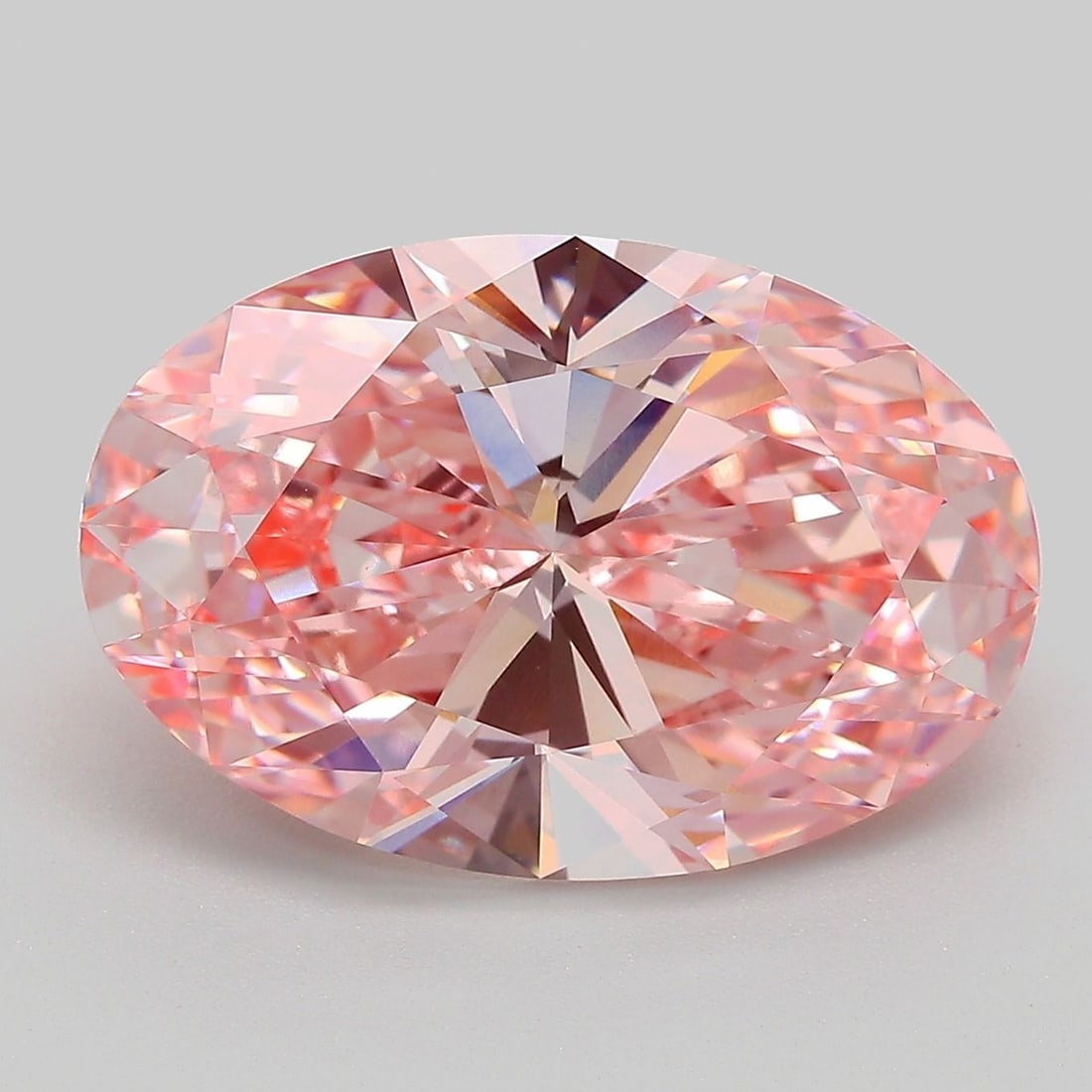 IGI Oval 8.0ct Fancy Vivid Pink VVS2 Loose Lab Diamond: IGI Oval 8.0ct Fancy Vivid Pink VVS2 Loose Lab Diamond Experience the breathtaking beauty of a lab-grown Fancy Vivid Pink diamond, certified by IGI as 8.0ct VVS2 in EX cut and polish. This stunning ge