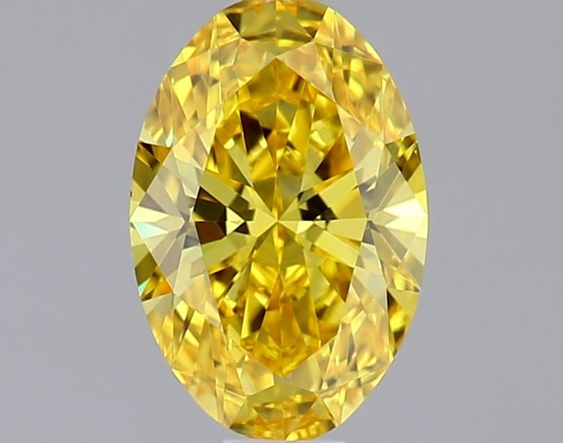 IGI Oval 0.57ct Fancy Vivid Yellow VVS2 Loose Lab Diamond: IGI Oval 0.57ct Fancy Vivid Yellow VVS2 Loose Lab Diamond Experience the radiant beauty of a lab-grown Fancy Vivid Yellow diamond, boasting exceptional clarity and color. This 0.57ct VVS2 gem shines w
