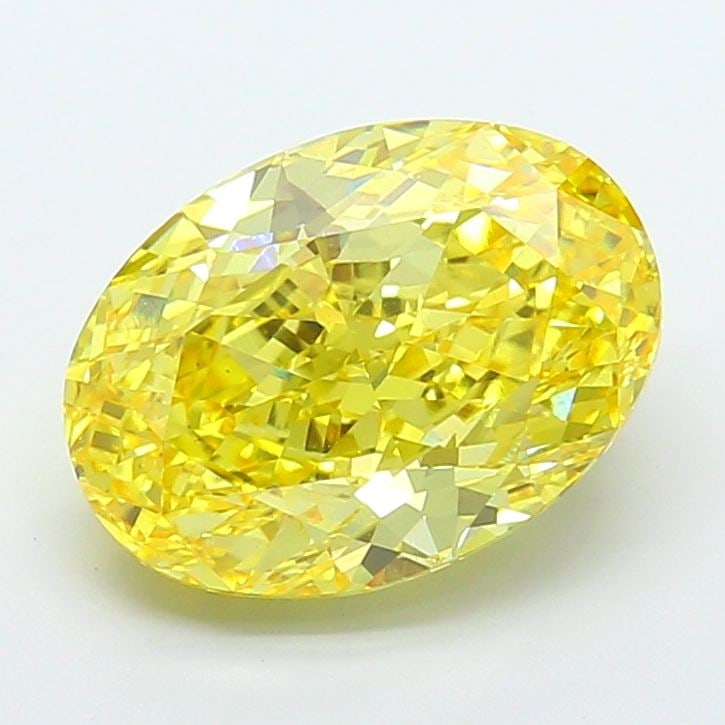 IGI Oval 7.02ct Fancy Vivid Yellow VVS2 Loose Lab Diamond: IGI Oval 7.02ct Fancy Vivid Yellow VVS2 Loose Lab Diamond Experience the brilliance of nature's own sunshine with this stunning 7.02ct Fancy Vivid Yellow VVS2 loose lab diamond, certified by the Inter