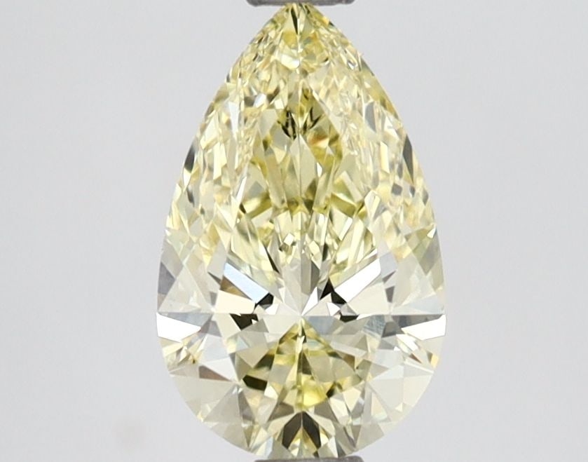 Loose Lab Diamond - IGI Pear 1.01ct Fancy Yellow VVS2: Loose Lab Diamond - IGI Pear 1.01ct Fancy Yellow VVS2 A rare and vibrant Fancy Yellow Lab Diamond, certified by the International Gemological Institute (IGI), boasts exceptional clarity (VVS2) and pol