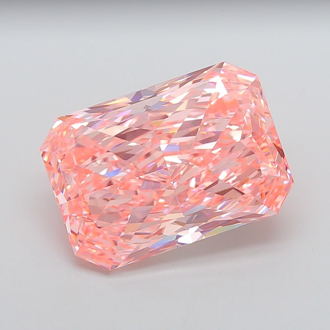 IGI Radiant 15.1ct Fancy Vivid Pink VVS2 Loose Lab Diamond: IGI Radiant 15.1ct Fancy Vivid Pink VVS2 Loose Lab Diamond Experience the rare beauty of a Fancy Vivid Pink diamond, one of the most striking colors in nature. This stunning 15.1ct lab-grown gem boast
