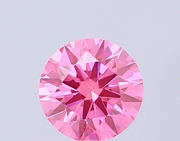 IGI Round 0.52ct Fancy Vivid Pink VVS2 Ideal Loose Lab Diamond: IGI Round 0.52ct Fancy Vivid Pink VVS2 Ideal Loose Lab Diamond Experience the rare beauty of a Fancy Vivid Pink diamond, one of the most coveted colors in nature. This stunning 0.52ct lab-grown gem