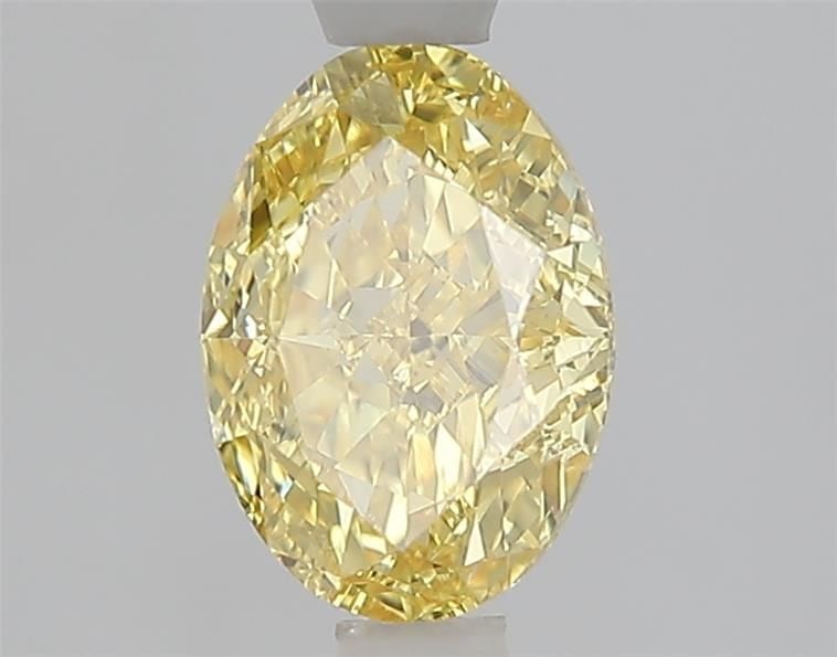 IGI Oval 1.44ct Fancy Vivid Yellow VVS2 Loose Lab Diamond: IGI Oval 1.44ct Fancy Vivid Yellow VVS2 Loose Lab Diamond A stunning Fancy Vivid Yellow VVS2 lab diamond, certified by the International Gemological Institute (IGI), boasts exceptional clarity and col