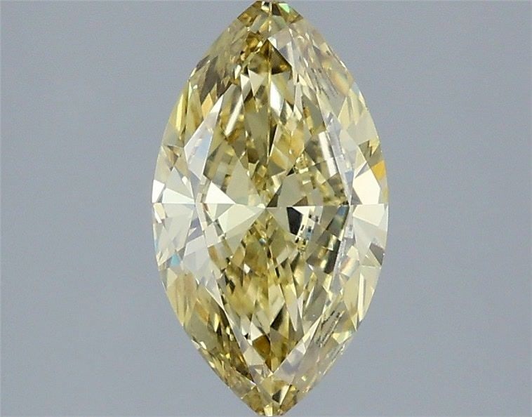 IGI Marquise 1.21ct Fancy Yellow VVS2 Loose Lab Diamond: IGI Marquise 1.21ct Fancy Yellow VVS2 Loose Lab Diamond A truly unique and radiant addition to any collection, this 1.21ct Fancy Yellow VVS2 loose lab diamond boasts exceptional clarity and color, wit