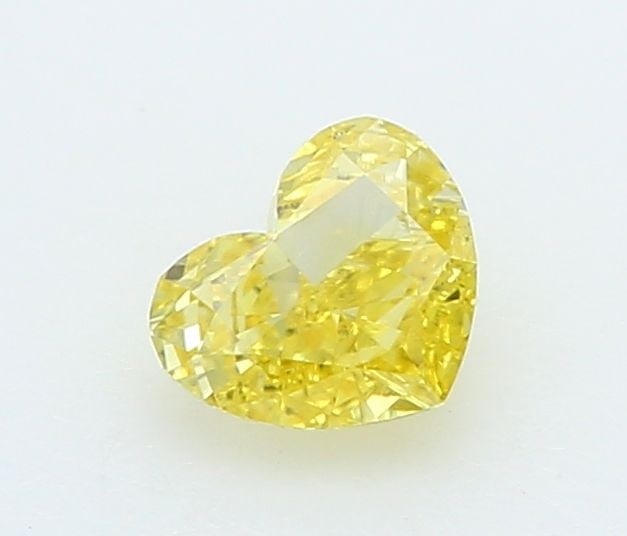 Loose Lab Diamond - IGI Heart 0.2ct Fancy Vivid Yellow VVS2: Loose Lab Diamond - IGI Heart 0.2ct Fancy Vivid Yellow VVS2 Experience the brilliance of a lab-grown diamond, certified by IGI as Fancy Vivid Yellow with exceptional clarity and cut. This 0.2ct gem sh