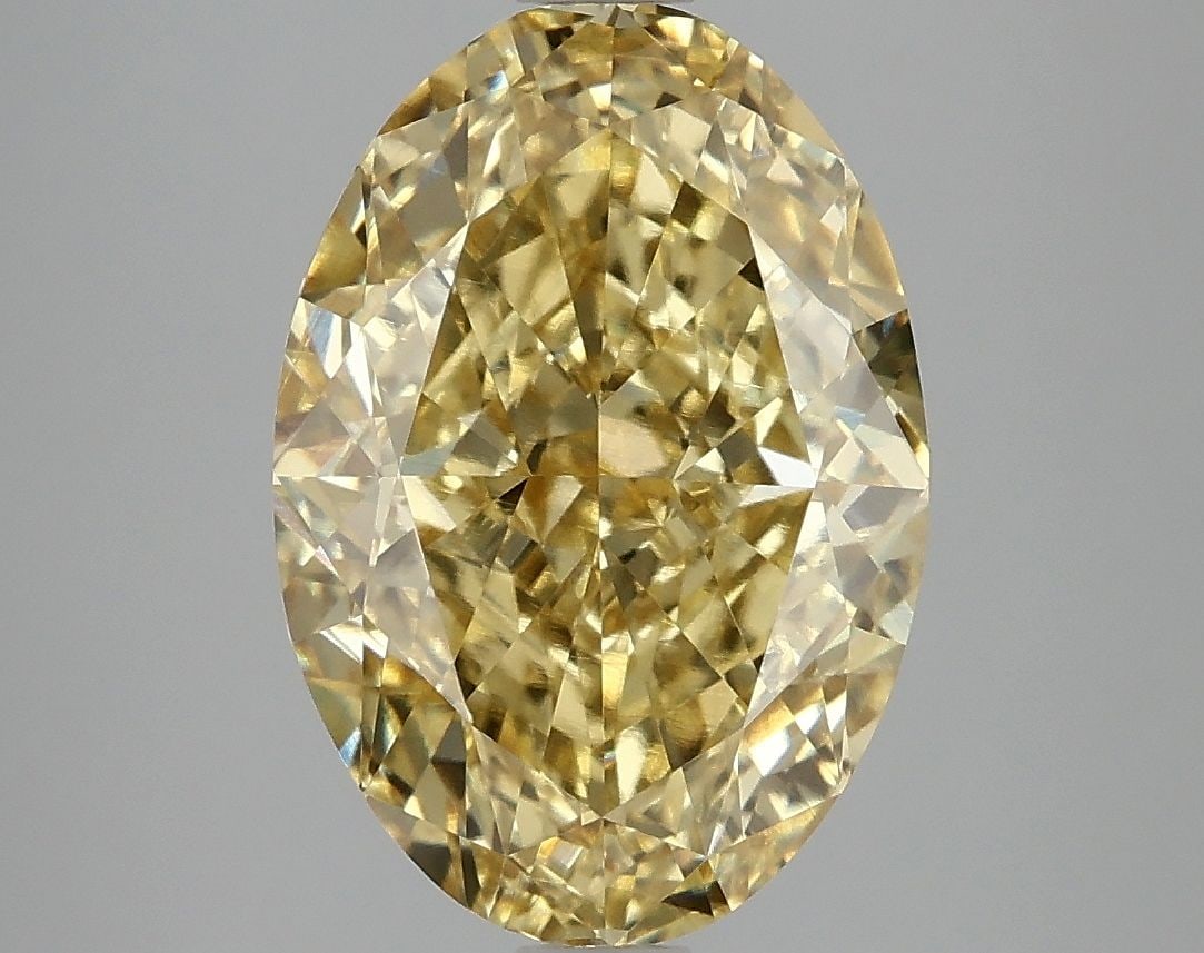 IGI Oval 5.07ct Fancy Vivid Yellow VVS2 Loose Lab Diamond: IGI Oval 5.07ct Fancy Vivid Yellow VVS2 Loose Lab Diamond Experience the beauty of nature in a lab-grown wonder - this 5.07ct Fancy Vivid Yellow VVS2 diamond is a true gem, boasting an EX polish and s