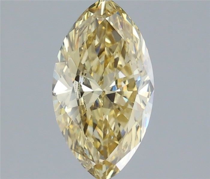 IGI Marquise 1.38ct Fancy Yellow VVS2 Loose Lab Diamond: IGI Marquise 1.38ct Fancy Yellow VVS2 Loose Lab Diamond Experience the beauty of a lab-grown fancy yellow diamond, certified by IGI as VVS2 in clarity and Fancy Yellow in color. This 1.38ct gemstone b