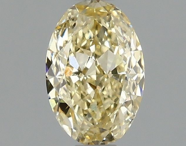 IGI Oval 1.01ct Fancy Yellow VVS2 Loose Lab Diamond: IGI Oval 1.01ct Fancy Yellow VVS2 Loose Lab Diamond Experience the beauty of nature with this stunning 1.01ct Fancy Yellow VVS2 loose lab diamond, certified by the International Gemological Institute