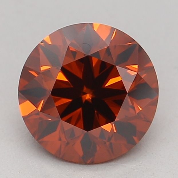 IGI Round 0.87ct Fancy Orange VVS2 Loose Lab Diamond: IGI Round 0.87ct Fancy Orange VVS2 Loose Lab Diamond Experience the vibrant beauty of a Fancy Orange VVS2 lab diamond, boasting an EX cut and exceptional symmetry. This stunning 0.87ct gem shines with
