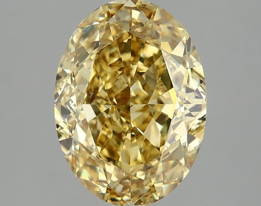 IGI Oval 3.09ct Fancy Vivid Yellow VVS2 Loose Lab Diamond: IGI Oval 3.09ct Fancy Vivid Yellow VVS2 Loose Lab Diamond Experience the warmth and brightness of a true lab-grown fancy vivid yellow diamond, boasting an impressive 3.09 carats in exceptional conditi