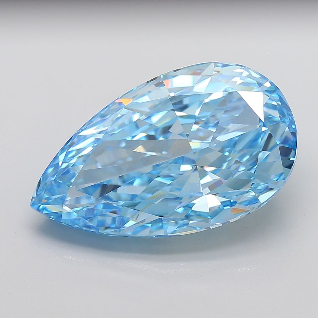 Loose Lab Diamond - IGI Pear 20.07ct Fancy Vivid Blue VVS2: Loose Lab Diamond - IGI Pear 20.07ct Fancy Vivid Blue VVS2 Experience the unparalleled beauty of a lab-grown diamond, certified by the International Gemological Institute (IGI) as Fancy Vivid Blue, wi