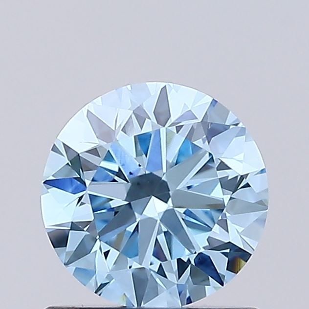 IGI Round 0.74ct Fancy Vivid Blue VVS2 Loose Lab Diamond: IGI Round 0.74ct Fancy Vivid Blue VVS2 Loose Lab Diamond Experience the rare beauty of a Fancy Vivid Blue lab-grown diamond, certified by IGI and boasting exceptional clarity (VVS2) and color intensit