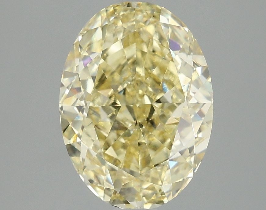 IGI Oval 3.03ct Fancy Vivid Yellow VVS2 Loose Lab Diamond: IGI Oval 3.03ct Fancy Vivid Yellow VVS2 Loose Lab Diamond Experience the vibrant beauty of nature with this stunning 3.03ct Fancy Vivid Yellow VVS2 loose lab diamond, certified by the International Ge