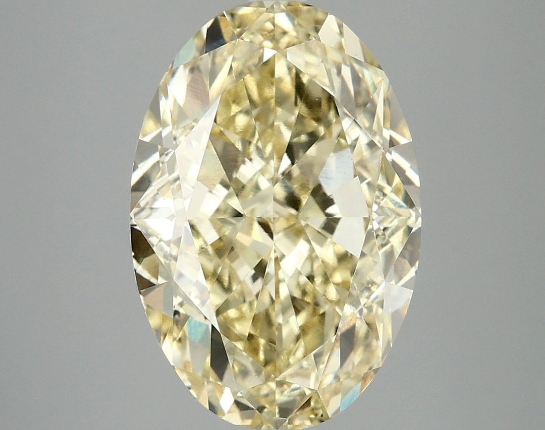 IGI Oval 6.1ct Fancy Vivid Yellow VVS2 Loose Lab Diamond: IGI Oval 6.1ct Fancy Vivid Yellow VVS2 Loose Lab Diamond Experience the brilliance of nature's own sunshine with this stunning 6.1ct Fancy Vivid Yellow VVS2 loose lab diamond, certified by the Interna