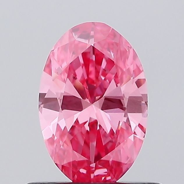 IGI Oval 0.54ct Fancy Vivid Pink VVS2 Loose Lab Diamond: IGI Oval 0.54ct Fancy Vivid Pink VVS2 Loose Lab Diamond Experience the rare beauty of a Fancy Vivid Pink diamond, one of the most coveted colors in the world of gemstones. This stunning 0.54ct lab-gro