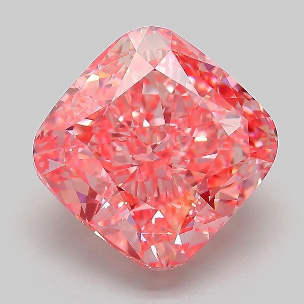 Loose Lab Diamond - IGI Cushion Modified 6.02ct Fancy Vivid Orangey Pink VVS2: Loose Lab Diamond - IGI Cushion Modified 6.02ct Fancy Vivid Orangey Pink VVS2 Experience the breathtaking beauty of a lab-grown diamond, certified by IGI as a Fancy Vivid Orangey Pink gemstone. This s