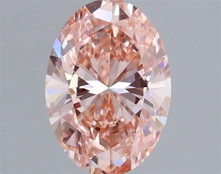 IGI Oval 2.0ct Fancy Vivid Pink VVS2 Diamond: IGI Oval 2.0ct Fancy Vivid Pink VVS2 Diamond Experience the rare beauty of a Fancy Vivid Pink diamond, one of the most coveted colors in the world of gemstones. This stunning 2.0ct oval-cut lab-grown