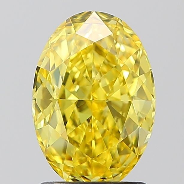 IGI Oval 1.72ct Fancy Vivid Yellow VVS2 Loose Lab Diamond: IGI Oval 1.72ct Fancy Vivid Yellow VVS2 Loose Lab Diamond A rare and vibrant Fancy Vivid Yellow diamond, certified by the International Gemological Institute (IGI), boasts exceptional clarity (VVS2) a