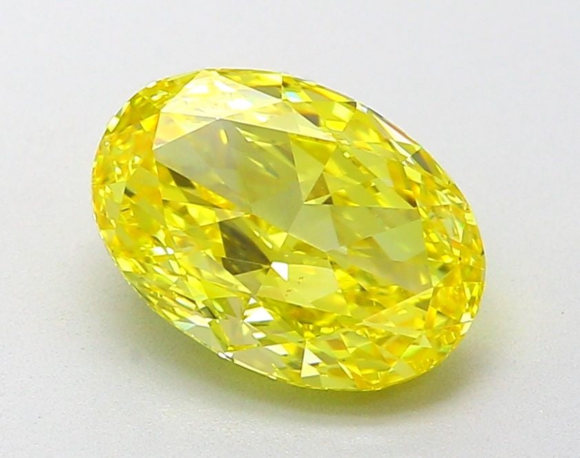 IGI Oval 2.02ct Fancy Vivid Yellow VVS2 Loose Lab Diamond: IGI Oval 2.02ct Fancy Vivid Yellow VVS2 Loose Lab Diamond Experience the brilliance of nature in a lab-grown diamond, certified by IGI as Fancy Vivid Yellow with exceptional clarity and cut. This 2.02