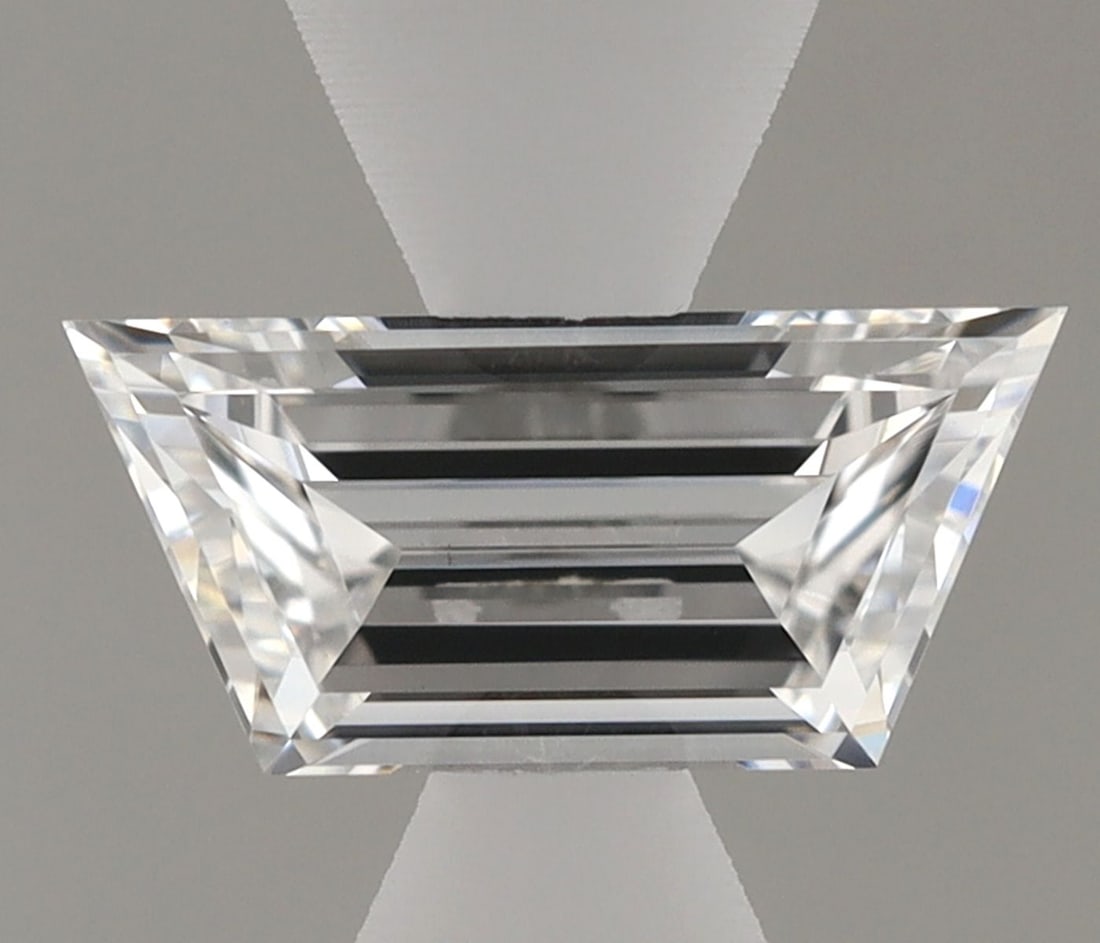 Loose Lab Diamond - Trapezoid 0.37ct E VVS2: Loose Lab Diamond - Trapezoid 0.37ct E VVS2 A rare opportunity to own a genuine lab-grown diamond, certified VVS2 clarity and boasting exceptional color grade E, this 0.37ct trapezoid-cut gemstone shi