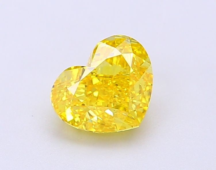 Loose Lab Diamond - IGI Heart 1.01ct Fancy Vivid Yellow VVS2: Loose Lab Diamond - IGI Heart 1.01ct Fancy Vivid Yellow VVS2 A rare and radiant gem, this 1.01ct Fancy Vivid Yellow Lab diamond boasts an exceptional VVS2 clarity and EX polish, giving it a dazzling b