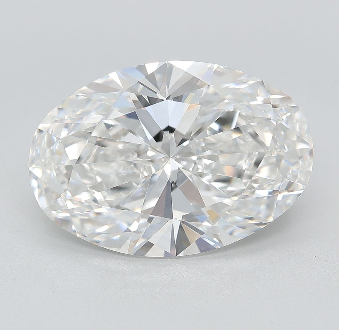 IGI Oval 9.68ct E VVS2 Loose Lab Diamond: IGI Oval 9.68ct E VVS2 Loose Lab Diamond Experience the exceptional beauty of a lab-grown diamond, certified by IGI as a stunning 9.68ct Oval cut E color, VVS2 clarity, and EX polish and symmetry. Thi
