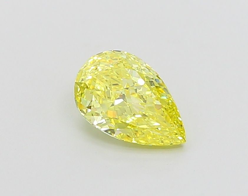 Loose Lab Diamond - IGI Pear 1.01ct Fancy Vivid Yellow VVS1: Loose Lab Diamond - IGI Pear 1.01ct Fancy Vivid Yellow VVS1 Experience the brilliance of a lab-grown diamond, certified by IGI as a Fancy Vivid Yellow gemstone with exceptional clarity and polish. Thi